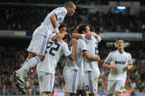 MADRID, SPAIN - NOVEMBER 07: Pepe (L) of Real Madrid celebrates with teammates after Real scored their first goal during the La Liga match between Real Madrid and Atletico Madrid at Estadio Santiago Bernabeu on November 7, 2010 in Madrid, Spain.  (Photo by Denis Doyle/Getty Images)