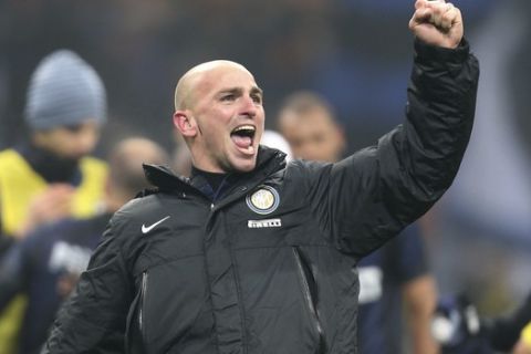 Inter Milan Argentine midfielder Esteban Cambiasso celebrates after winning the Serie A soccer match between Inter Milan and AC Milan at the San Siro stadium in Milan, Italy, Sunday, Dec. 22, 2013. A late goal from Rodrigo Palacio gave Inter Milan a 1-0 win over city rival AC Milan in an entertaining derby match in Serie A on Sunday. Palacio struck four minutes from time to send three quarters of San Siro into a frenzy. (AP Photo/Antonio Calanni)