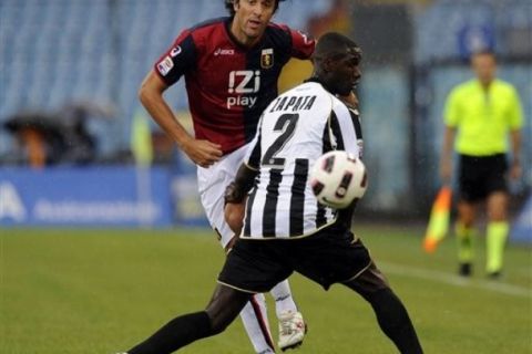 Genoa's Luca Toni, left, is challenged by Udinese's Cristian Zapata of Colombia during a Serie A soccer match between Udinese and Genoa in Udine, Italy, Saturday, Aug. 28, 2010. (AP Photo/Franco Debernardi)