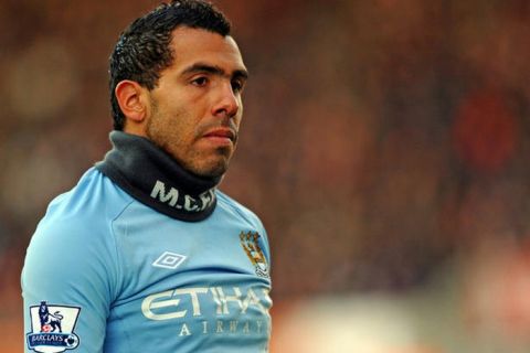 Manchester City's Argentinian striker Carlos Tevez looks on during the English Premier League football match between Stoke City and Manchester City at the Britannia Stadium, Stoke-on-Trent, Staffordshire, central midlands, England on November 27, 2010. AFP PHOTO/PAUL ELLIS

FOR EDITORIAL USE ONLY Additional licence required for any commercial/promotional use or use on TV or internet (except identical online version of newspaper) of Premier League/Football League photos. Tel DataCo +44 207 2981656. Do not alter/modify photo. (Photo credit should read PAUL ELLIS/AFP/Getty Images)