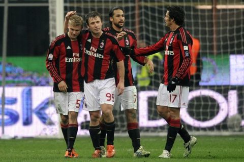 AC Milan's German midfielder Alexander Merkel (L) celebrates with his team-mate AC Milan's forward Antonio Cassano after scoring against Bari during their Italian Cup 1/8 finals match in San Siro stadium in Milan on January 20, 2011. AFP PHOTO / OLIVIER MORIN (Photo credit should read OLIVIER MORIN/AFP/Getty Images)