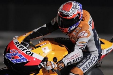 MotoGP Honda rider and pole position Casey Stoner of Australia steers his bike during the Qualifying Practice for the Grand Prix of Qatar at the Losail International Circuit in Doha, Qatar, Saturday, March 19, 2011. The 2011 MotoGP season , which includes the 125cc, Moto2 classes as well as MotoGP, gets underway on Sunday March 20 at Qatar's Losail circuit. (AP Photo/Hassan Ammar)