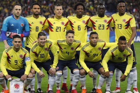 The Columbian national soccer team poses before a friendly soccer match against France at the Stade de France stadium in Saint-Denis, outside Paris, France, Friday March 23, 2018. First row from left to right : Radamel Falcao, James Rodriguez, Santiago Arias, Luis Fernando Muriel and Frank Fabra. Second row from left to right : David Ospina, Abel Aguilar, Mateus Uribe, Carlos Alberto Sanchez, Davison Sanchez and Yerry Mina. (AP Photo/Francois Mori)