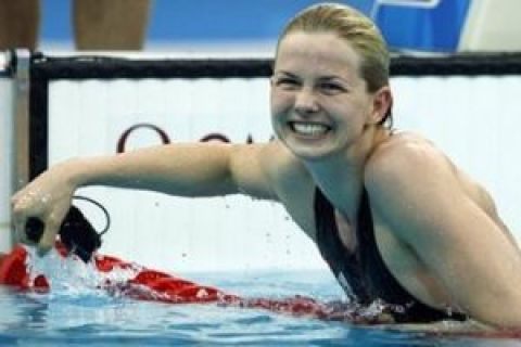 FILE - The Aug. 17, 2008 file photo shows Germany's Britta Steffen smiling after winning the gold in the women's 50-meter freestyle final during the swimming competitions in the National Aquatics Center at the Beijing 2008 Olympics in Beijing. On Thursday, June 25, 2009 Steffen set a new world record during the German Swimming Championships in Berlin. Steffen clocked 52.85 seconds in a preliminary heat of the Women's 100m Freestyle.   (AP Photo/Mark Baker, file)