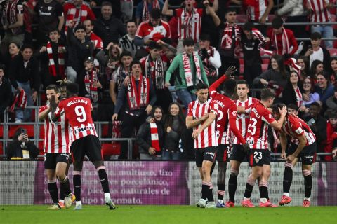 Athletic Bilbao's Gorka Guruzeta celebrates with teammates after scoring his sides second goal during the Spanish La Liga soccer match between Athletic Bilbao and Real Madrid at the San Mames stadium in Bilbao, Spain, Wednesday, Dec. 4, 2024. (AP Photo/Miguel Oses)