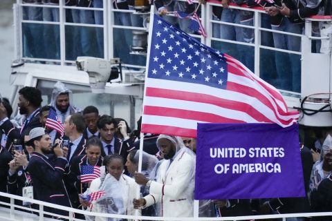 United States' Coco Gauff and Lebron James, bottom center, travel with teammates along the Seine River in Paris, France, during the opening ceremony of the 2024 Summer Olympics, Friday, July 26, 2024. (AP Photo/Kirsty Wigglesworth)