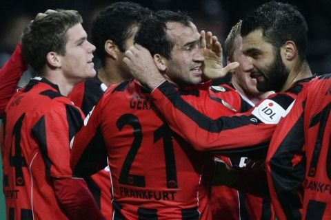 Eintracht Frankfurt's Thoefanis Gekas (C) celebrates a goal against Hamburg SV during their German Soccer Cup (DFB-Pokal) match in Frankfurt October 27, 2010. REUTERS/Alex Domanski (GERMANY - Tags: SPORT SOCCER) DFB RULES PROHIBIT USE IN MMS SERVICES VIA HANDHELD DEVICES UNTIL TWO HOURS AFTER A MATCH AND ANY USAGE ON INTERNET OR ONLINE MEDIA SIMULATING VIDEO FOOTAGE DURING THE MATCH