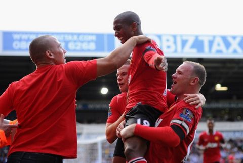 WEST BROMWICH, ENGLAND - AUGUST 14:  Ashley Young of Manchester United celebrates his team's second goal with Wayne Rooney (R) during the Barclays Premier League match between West Bromwich Albion and Manchester United at The Hawthorns on August 14, 2011 in West Bromwich, England.  (Photo by Mike Hewitt/Getty Images)