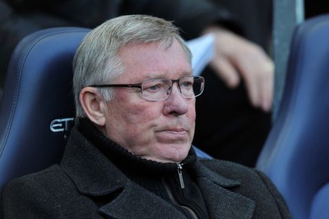 Manchester United manager Alex Ferguson gestures as he watches his team play against Manchester City during their English Premier League match at The Etihad Stadium in Manchester, north-west England, on April 30, 2012. AFP PHOTO/PAUL ELLIS
 - RESTRICTED TO EDITORIAL USE. No use with unauthorized audio, video, data, fixture lists, club/league logos or live services. Online in-match use limited to 45 images, no video emulation. No use in betting, games or single club/league/player publications        (Photo credit should read PAUL ELLIS/AFP/GettyImages)