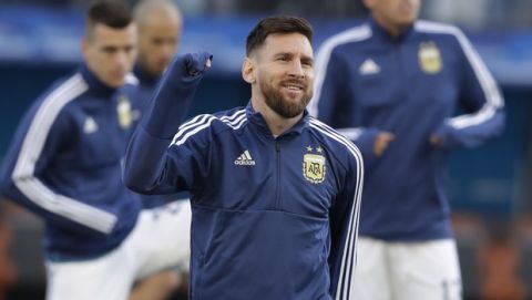 Argentina's Lionel Messi warms up prior to the Copa America soccer match for the third place against Brazil at the Arena Corinthians in Sao Paulo, Brazil, Saturday, July 6, 2019. (AP Photo/Andre Penner)