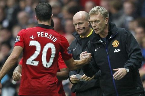 (FILES) -- A file picture taken on August 17, 2013 shows Manchester United's Scottish manager David Moyes (R) shaking hands with Manchester United's Dutch striker Robin van Persie (L) at Liberty Stadium in Swansea, south Wales. Van Persie on September 5, 2013 hailed Moyes as he nixed rumours about his apparent unhappiness over coaching methods at Old Trafford. "It's wonderful to work with new manager David Moyes," Van Persie told the Dutch popular daily broadsheet De Telegraaf. AFP PHOTO/IAN KINGTONIAN KINGTON/AFP/Getty Images