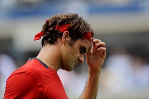 Number three seed Roger Federer of Switzerland reacts to a shot to number one seed Novak Djokovic of Serbia during a Men's semifinal match at the US Open tennis tournament September 10, 2011 at the Billie Jean King National Tennis Center in New York. Djokovic won 6-7 (7/9), 4-6, 6-3, 6-2, 7-5.     AFP PHOTO/Stan HONDA (Photo credit should read STAN HONDA/AFP/Getty Images)