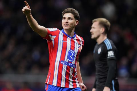 Atletico Madrid's Julian Alvarez celebrates after scoring the opening goal during the Champions League opening phase soccer match between Atletico Madrid and Slovan Bratislava at Riyadh Air Metropolitano stadium in Madrid, Spain, Wednesday, Dec. 11, 2024. (AP Photo/Manu Fernandez)