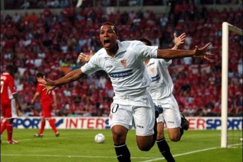 Seville'S Luis Fabiano celebrates scoring the opening goal