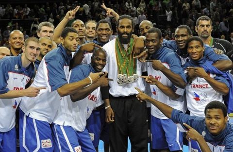 France's players pose for photographers with Ronnie Turiaf (C) after winning silver in the Eurobasket 2011 in Kaunas on September 18, 2011. Spain defeated France 98-85. AFP PHOTO / JANEK SKARZYNSKI (Photo credit should read JANEK SKARZYNSKI/AFP/Getty Images)