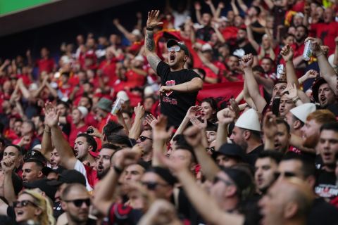 Albanian fans cheer at the stand ahead of a Group B match between Albania and Spain at the Euro 2024 soccer tournament in Dusseldorf, Germany, Monday, June 24, 2024. (AP Photo/Manu Fernandez)