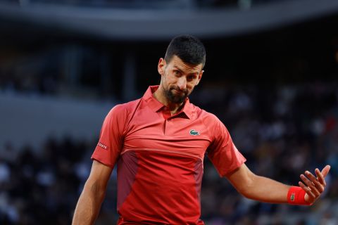 Serbia's Novak Djokovic waits for balls to serve against France's Pierre-Hugues Herbert during their first round match of the French Open tennis tournament at the Roland Garros stadium in Paris, Tuesday, May 28, 2024. (AP Photo/Jean-Francois Badias)