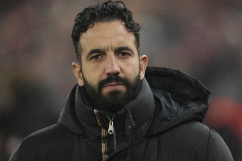 Manchester United's head coach Ruben Amorim waits for the beginning of the English Premier League soccer match against Liverpool at the Anfield stadium in Liverpool, England Sunday, Jan. 5, 2025. (AP Photo/Jon Super)