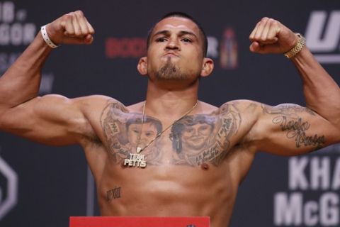 Anthony Pettis poses during a ceremonial weigh-in for the UFC 229 mixed martial arts fight Friday, Oct. 5, 2018, in Las Vegas. Pettis is scheduled to fight Tony Ferguson Saturday in Las Vegas. (AP Photo/John Locher)