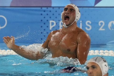 Greece's Stylianos Argyropoulos Kanakakis gestures during a men's water polo Group A preliminary match between Greece and the United States, at the 2024 Summer Olympics, Thursday, Aug. 1, 2024, in Saint-Denis, France. (AP Photo/Luca Bruno)