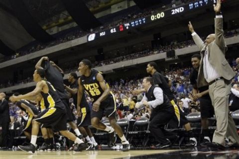 Virginia Commonwealth leaves the bench after winning the Southwest regional final game against Kansas in the NCAA college basketball tournament Sunday, March 27, 2011, in San Antonio. VCU won 71-61. (AP Photo/Eric Gay)