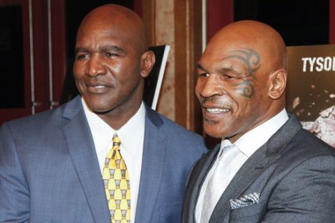 Evander Holyfield, left, and Mike Tyson, attend a special screening of "Champs" at the Village East Cinema on Thursday, March 12, 2015, in New York. (Photo by Andy Kropa/Invision/AP)