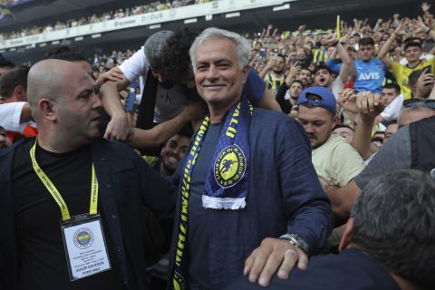 Portuguese soccer coach Jose Mourinho poses for the media with supporters during his official presentation as Turkish's Fenerbahce new coach at Sukru Saracoglu stadium in Istanbul, Turkey, Sunday, June 2, 2024. Mourinho has signed a two-year contract with Fenerbahce. (AP Photo)