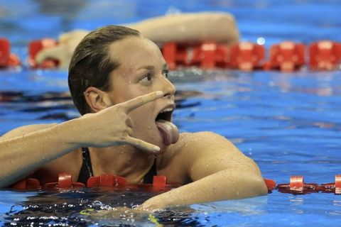 Italy's Federica Pellegrini reacts after winning the women's 200m freestyle final at the 14th FINA World Championships in Shanghai July 27, 2011. REUTERS/Christinne Muschi (CHINA  - Tags: SPORT SWIMMING AQUATICS)