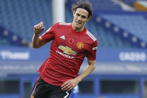 Manchester United's Edinson Cavani, celebrates after scoring his side's third goal during the English Premier League soccer match between Everton and Manchester United at the Goodison Park stadium in Liverpool, England, Saturday, Nov. 7, 2020. (Clive Brunskill/Pool via AP)