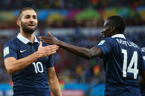 PORTO ALEGRE, BRAZIL - JUNE 15:  Karim Benzema of France (L) celebrates after scoring his team's third goal with teammate Blaise Matuidi during the 2014 FIFA World Cup Brazil Group E match between France and Honduras at Estadio Beira-Rio on June 15, 2014 in Porto Alegre, Brazil.  (Photo by Paul Gilham/Getty Images)