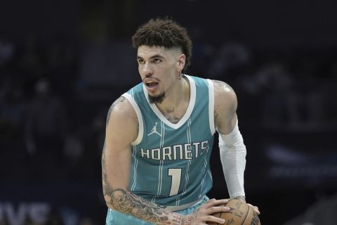 Charlotte Hornets guard LaMelo Ball brings the ball down court against the Indiana Pacers during the second half of an NBA basketball game Friday, Nov. 8, 2024, in Charlotte, N.C. (AP Photo/Chris Carlson)