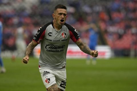 Brian Lozano of Atlas celebrates after scoring the opening goal against Cruz Azul during a Mexican soccer league match at Azteca Stadium, in Mexico City, Saturday, May 6, 2023. (AP Photo/Fernando Llano)