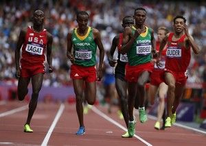 (L to R) Bernard Lagat of the U.S., Ethiopia's Yenew Alamirew, compatriot Dejen Gebremeskel and Morocco's Abdalaati Iguider race to the finish line in their men's 5000m round 1 heat during the London 2012 Olympic Games at the Olympic Stadium August 8, 2012.  REUTERS/Lucy Nicholson (BRITAIN  - Tags: OLYMPICS SPORT ATHLETICS)  