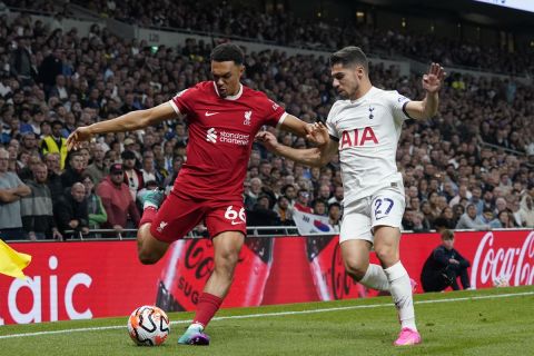 Liverpool's Trent Alexander-Arnold, left, and Tottenham's Manor Solomon battle for the ball during the English Premier League soccer match between Tottenham Hotspur and Liverpool at the Tottenham Hotspur Stadium, in London, England, Saturday, Sept. 30, 2023. (AP Photo/Alberto Pezzali)