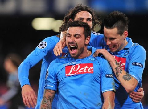 Napoli's Argentine forward Ezequiel Ivan Lavezzi (L) celebrates vwith  Napoli's Uruguayan forward Edinson Roberto Cavani (back) after scoring during the Champions League round of 16 first leg football match, Napoli vs Chelsea at San Paolo stadium in Naples on February 21, 2012.   AFP PHOTO / ALBERTO PIZZOLI (Photo credit should read ALBERTO PIZZOLI/AFP/Getty Images)