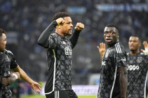 Ajax's Chuba Akpom, centre, celebrates with teammates after scoring his side's third goal during the Europa League Group B soccer match between Olympique de Marseille and Ajax at the Velodrome Stadium, in Marseille, France, Thursday, Nov. 30, 2023. (AP Photo/Daniel Cole)