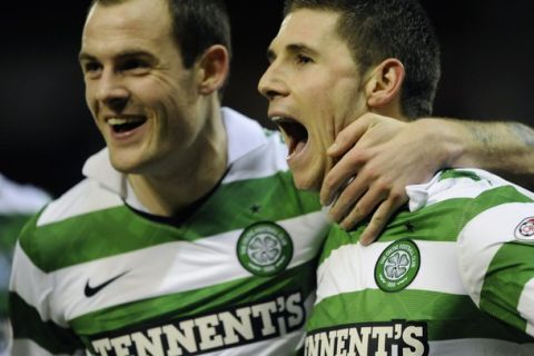 Celtic's Gary Hooper (R) celebrates his goal with Anthony Stokes against Aberdeen during their Scottish Premier League soccer match at Pittodrie Stadium , Aberdeen, Scotland, February 1, 2011. REUTERS/Russell Cheyne (BRITAIN - Tags: SPORT SOCCER)