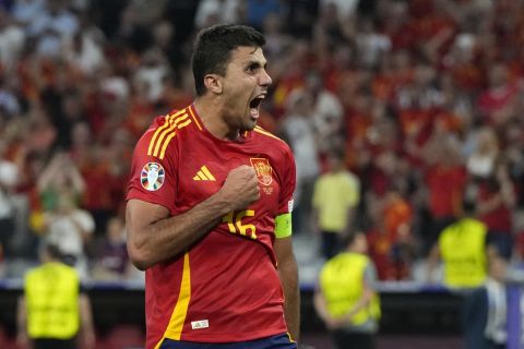 Spain's Rodri celebrates at the end of the semifinal match between Spain and France at the Euro 2024 soccer tournament in Munich, Germany, Tuesday, July 9, 2024. (AP Photo/Hassan Ammar)