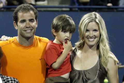 Pete Sampras, of the United States, poses with family members during a ceremony recognizing him as the tournament honoree at the L.A. Tennis Open, Monday, July 27, 2009, in Los Angeles. From left to right: sister Marion; sister Stella Sampras Webster; parents Sammy and Georgia Sampras; son Ryan; wife Bridgette Wilson; son Christian and brother Gus. (AP Photo/Danny Moloshok)