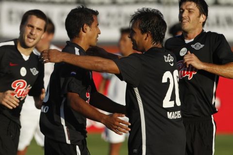 Sergio Aquino (2nd R) of Paraguay's Libertad celebrates his goal against Peru's Universidad de San Martin with teammates during their Copa Libertadores soccer match in Lima March 15, 2011. REUTERS/Pilar Olivares(PERU - Tags: SPORT SOCCER)