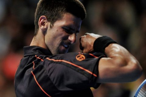 Serbian tennis player Novak Djokovic gestures during an exhibition match with Rafael Nadal of Spain at El Campin Coliseum in Bogota, Colombia, on March 21, 2011. AFP PHOTO / Guillermo Legaria (Photo credit should read GUILLERMO LEGARIA/AFP/Getty Images)