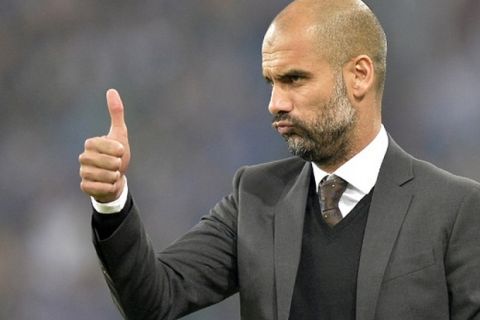 Bayern head coach Pep Guardiola of Spain gestures during the German soccer Bundesliga match between FC Schalke 04 and Bayern Munich at the arena in Gelsenkirchen, Germany, Saturday, Sept. 21, 2013. Schalke was defeated by Bayern with 0-4. (AP Photo/Martin Meissner)