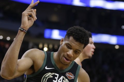 Milwaukee Bucks' Giannis Antetokounmpo reacts after he scored against the Phoenix Suns during the second half of an NBA basketball game Friday, Nov. 23, 2018, in Milwaukee. (AP Photo/Jeffrey Phelps)