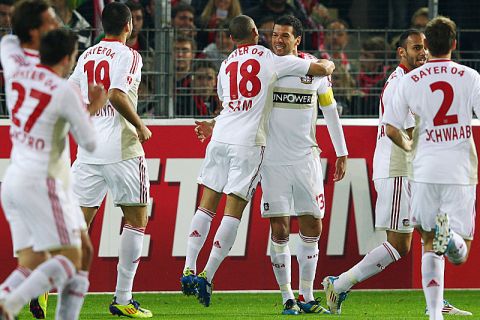 FREIBURG IM BREISGAU, GERMANY - OCTOBER 28: Michael Ballack of Leverkusen celebrates his team's first goal with team mate Sidney Sam during the Bundesliga match between SC Freiburg and Bayer 04 Leverkusen at Badenova Stadium on October 28, 2011 in Freiburg im Breisgau, Germany.  (Photo by Alex Grimm/Bongarts/Getty Images)