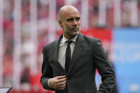 Manchester City's head coach Pep Guardiola gestures prior to the English FA Cup final soccer match between Manchester City and Manchester United at Wembley Stadium in London, Saturday, May 25, 2024. (AP Photo/Kin Cheung)