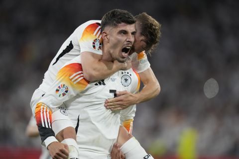 Germany's Kai Havertz celebrates with Joshua Kimmich after scoring his side's third goal during a Group A match between Germany and Scotland at the Euro 2024 soccer tournament in Munich, Germany, Friday, June 14, 2024. (AP Photo/Matthias Schrader)