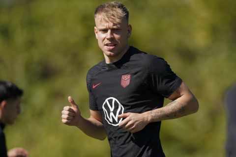 United States midfielder Lennard Maloney runs across the field during a soccer training session Tuesday, Oct. 10, 2023, in Brentwood, Tenn. (AP Photo/George Walker IV)