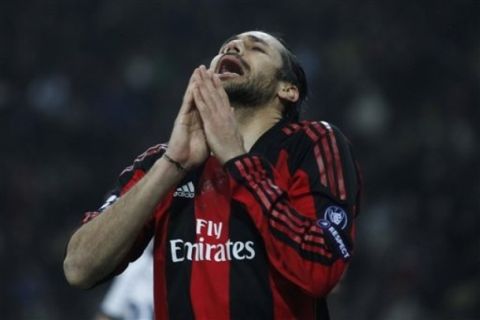 AC Milan defender Mario Yepes, of Colombia,  reacts after missing a scoring chance during a Champions League, round of 16 first leg soccer match between AC Milan and Tottenham Hotspur at the San Siro stadium in Milan , Italy, Tuesday, Feb. 15, 2011. (AP Photo/Luca Bruno)