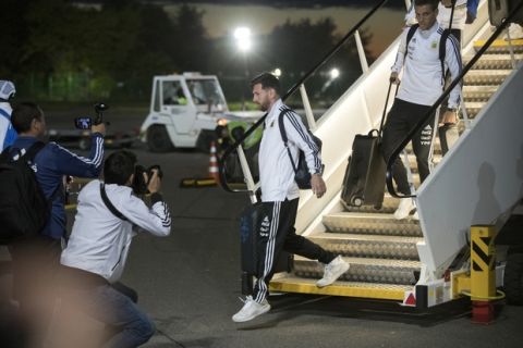 Lionel Messi, center, disembarks the plane as the Argentina national soccer team arrive at Zhukovsky international airport outside Moscow, Russia, Saturday, June 9, 2018 to compete in the 2018 World Cup in Russia. The 21st World Cup begins on Thursday, June 14, 2018, when host Russia takes on Saudi Arabia. (AP Photo/Pavel Golovkin)