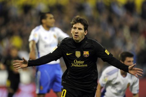 Barcelona's Argentinian forward Lionel Messi celebrates after scoring a goal during the Spanish League football match between Real Zaragoza and FC Barcelona on April 7, 2012 at La Romareda stadium in Zaragoza. AFP PHOTO/LLUIS GENE (Photo credit should read LLUIS GENE/AFP/Getty Images)